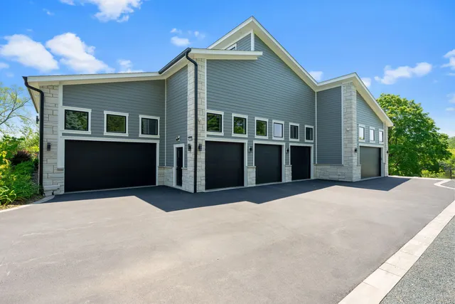 an aerial view of a house with a big yard