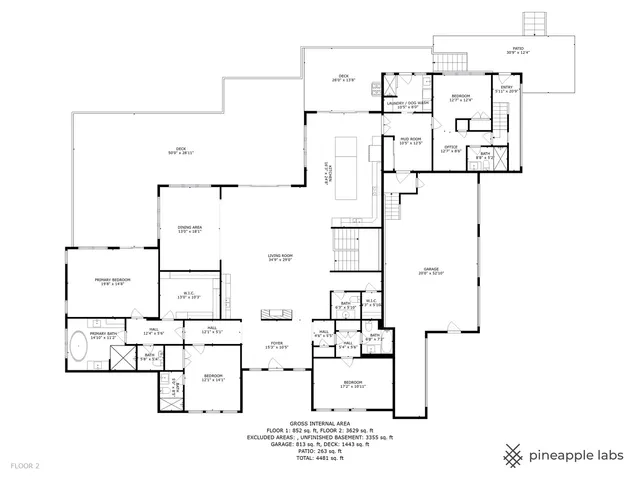 a front view of a house with a big yard and potted plants