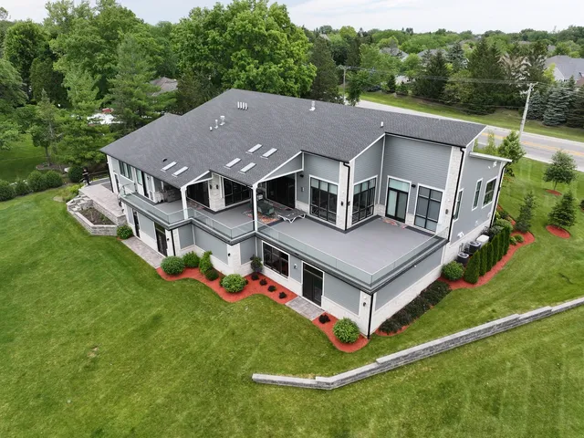 a front view of house with a garden