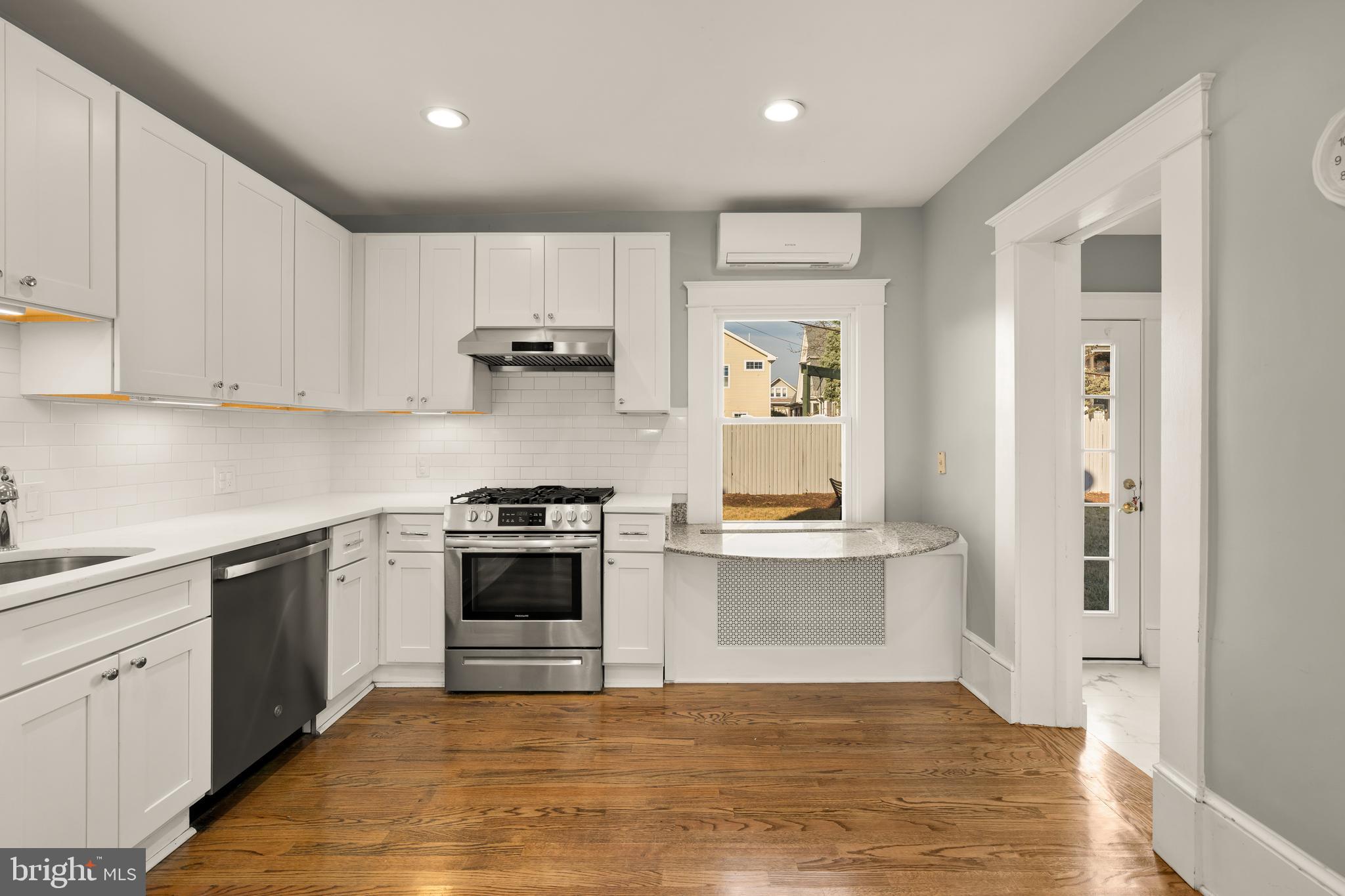1308 Lawrence Street Northeast Washington, DC 20017 - Photo 16 of 43 a kitchen with stainless steel appliances granite countertop a stove and a sink