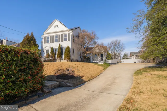 a view of multiple houses with a street