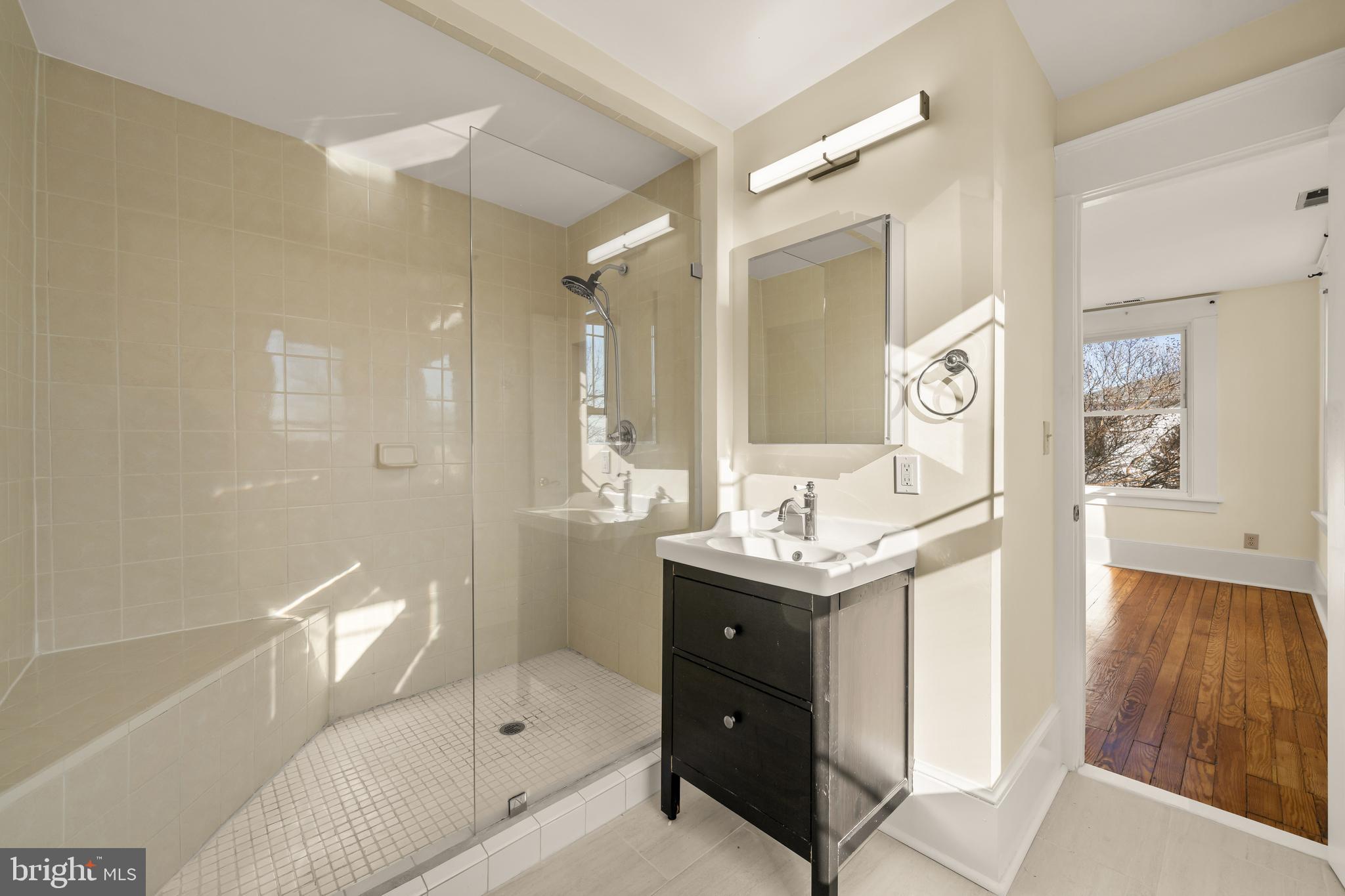 1308 Lawrence Street Northeast Washington, DC 20017 - Photo 29 of 43 a bathroom with a sink a toilet and shower