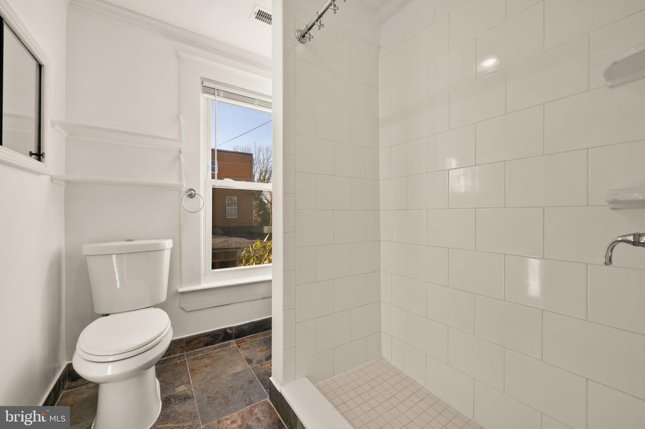 1308 Lawrence Street Northeast Washington, DC 20017 - Photo 33 of 43 a bathroom with a toilet a sink and a shower