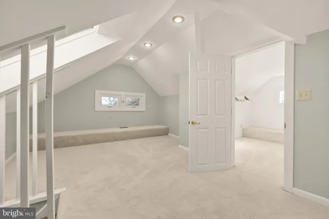 an empty room with windows and entrance