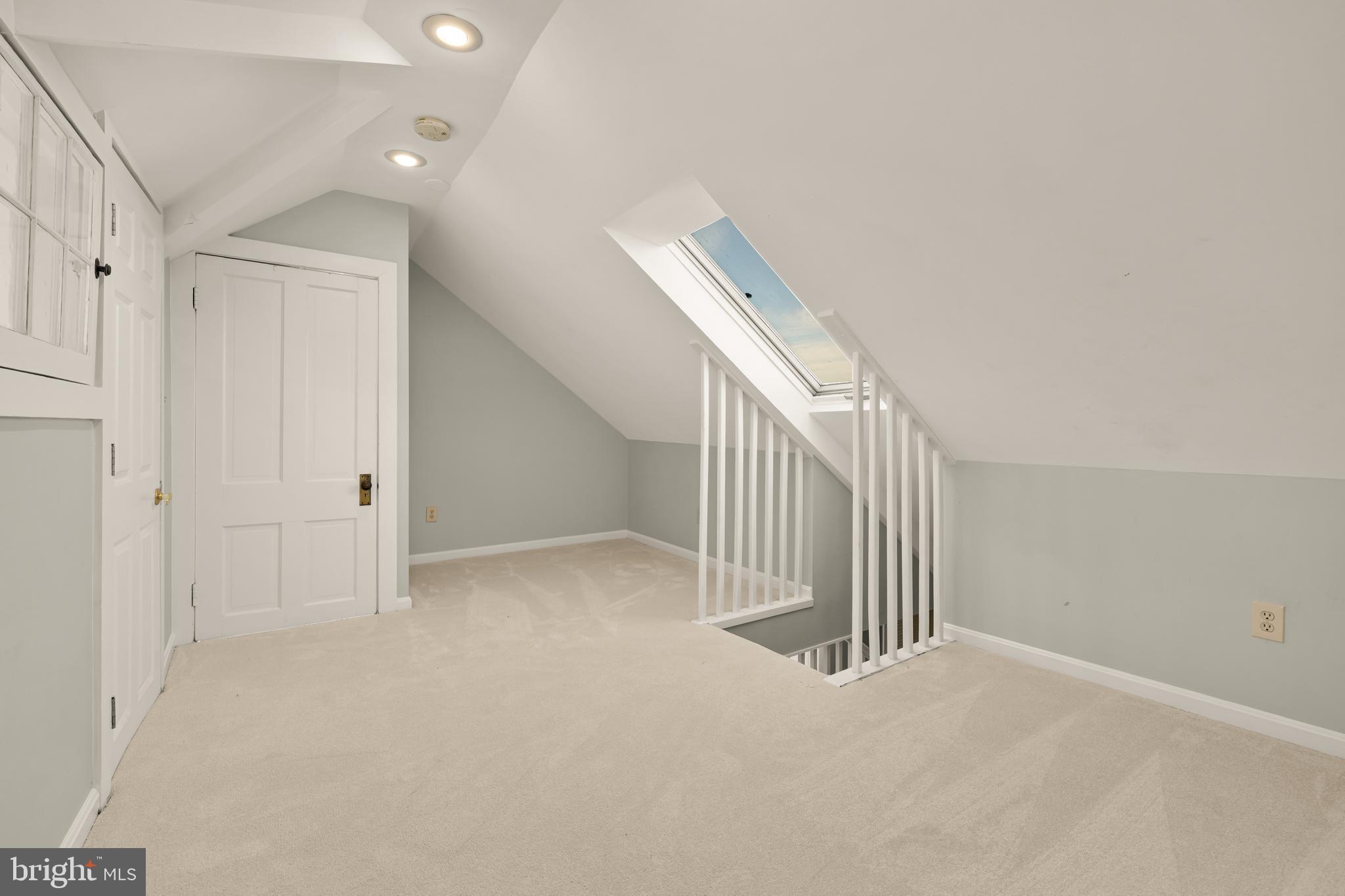 1308 Lawrence Street Northeast Washington, DC 20017 - Photo 37 of 43 a view of a livingroom with stairs and white walls