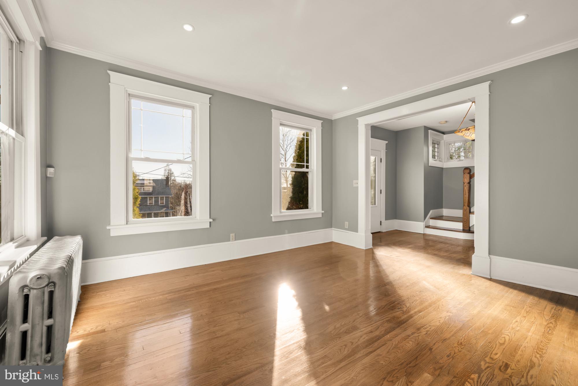 1308 Lawrence Street Northeast Washington, DC 20017 - Photo 8 of 43 a view of an empty room with wooden floor and a window