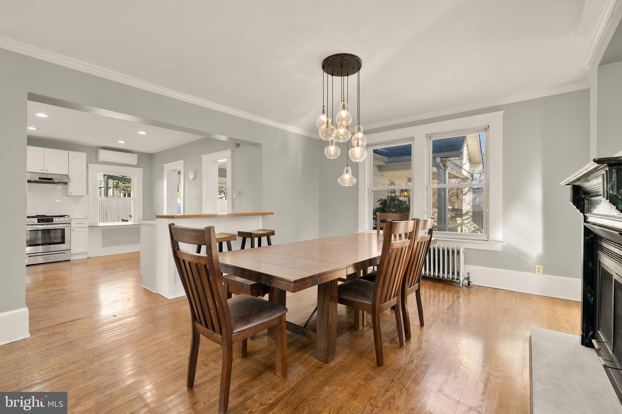 1308 Lawrence Street Northeast Washington, DC 20017 - Photo 10 of 43 a view of a dining room with furniture wooden floor and chandelier