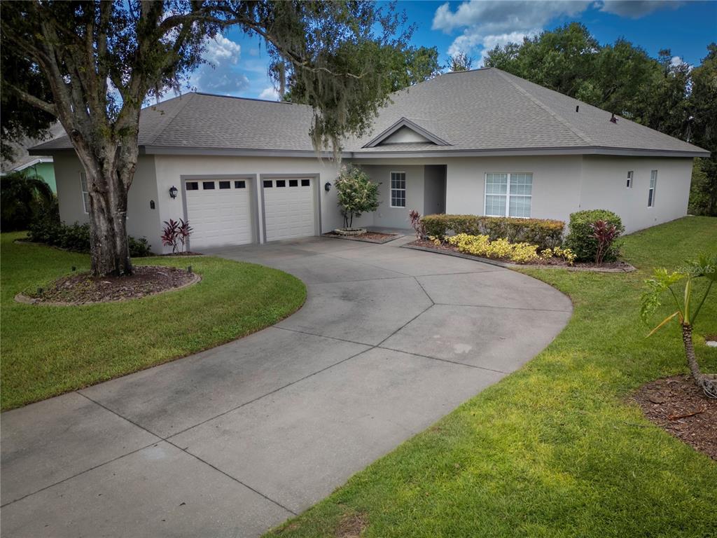 1137 Pristine Place Lutz, FL 33549 - Photo 1 of 1 a front view of a house with garden