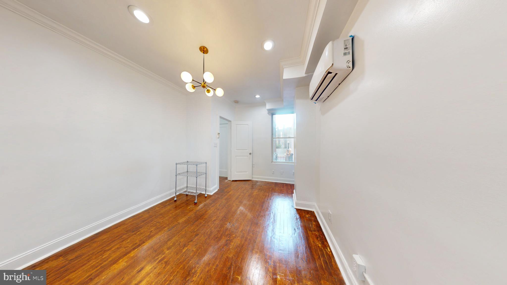 1315 Pennsylvania Ave. Southeast, Unit B Washington, DC 20003 - Photo 10 of 19 a view of a livingroom with a staircase