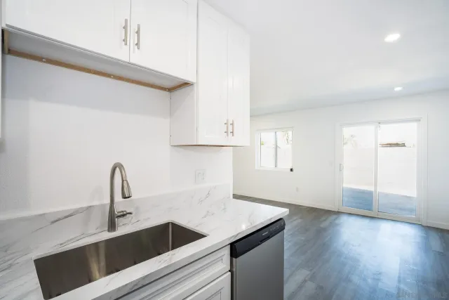 a kitchen with a sink and cabinets