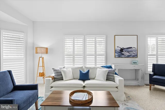 a kitchen with a stove a sink a microwave a refrigerator and cabinets