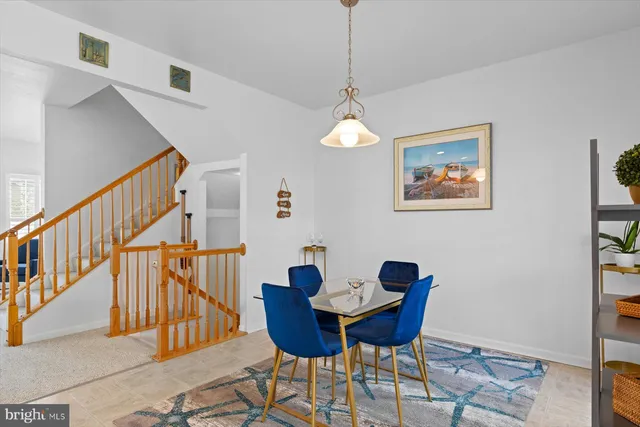 a kitchen with granite countertop a stove and a white cabinets