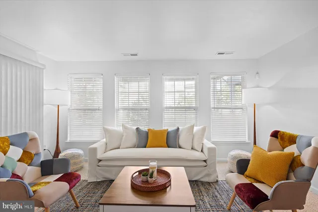 a bed room with a bed a couch and a fireplace