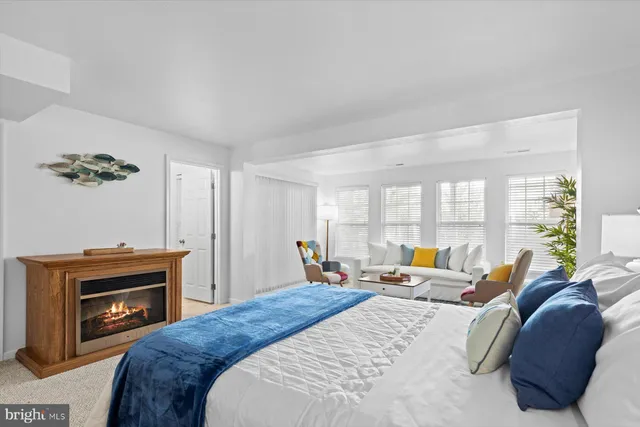 a bedroom with a bed and a fireplace