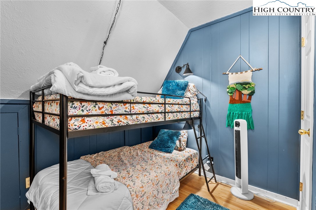 179 Rhododendron Drive Beech Mountain, NC 28604 - Photo 18 of 44 a bedroom with bed and a window