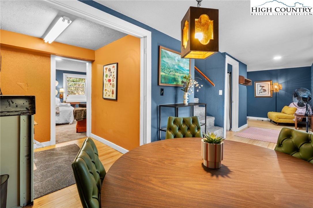 179 Rhododendron Drive Beech Mountain, NC 28604 - Photo 22 of 44 a view of a living room and dining room