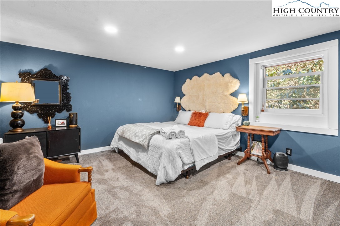 179 Rhododendron Drive Beech Mountain, NC 28604 - Photo 26 of 44 a bedroom with a bed and window