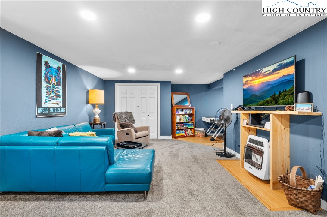 179 Rhododendron Drive Beech Mountain, NC 28604 - Photo 27 of 44 a living room with furniture and a flat screen tv