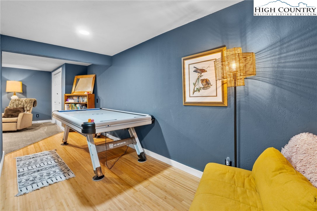 179 Rhododendron Drive Beech Mountain, NC 28604 - Photo 31 of 44 a bed room with a bed and a painting on the wall