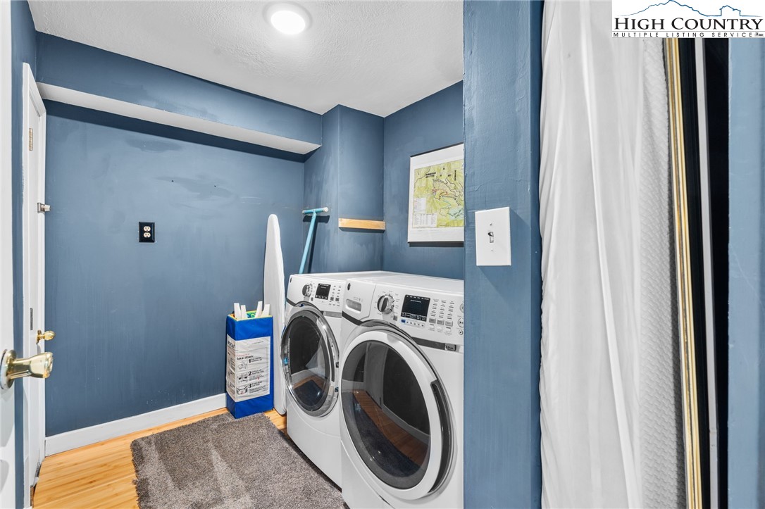 179 Rhododendron Drive Beech Mountain, NC 28604 - Photo 32 of 44 a utility room with dryer and washer