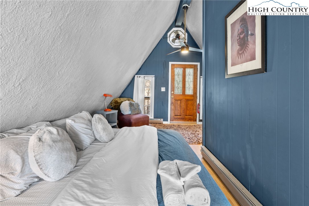 179 Rhododendron Drive Beech Mountain, NC 28604 - Photo 34 of 44 a bed room with a bed and a window