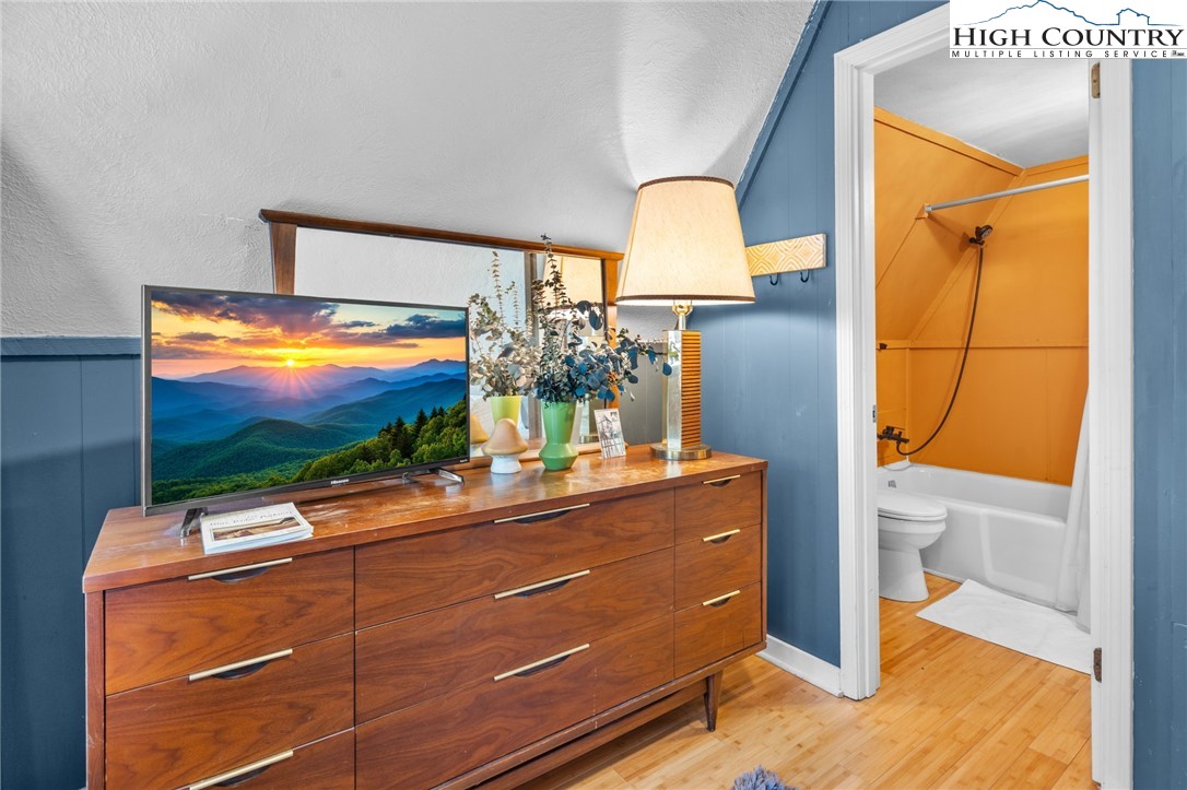 179 Rhododendron Drive Beech Mountain, NC 28604 - Photo 35 of 44 a room with window mirror and a flat screen tv