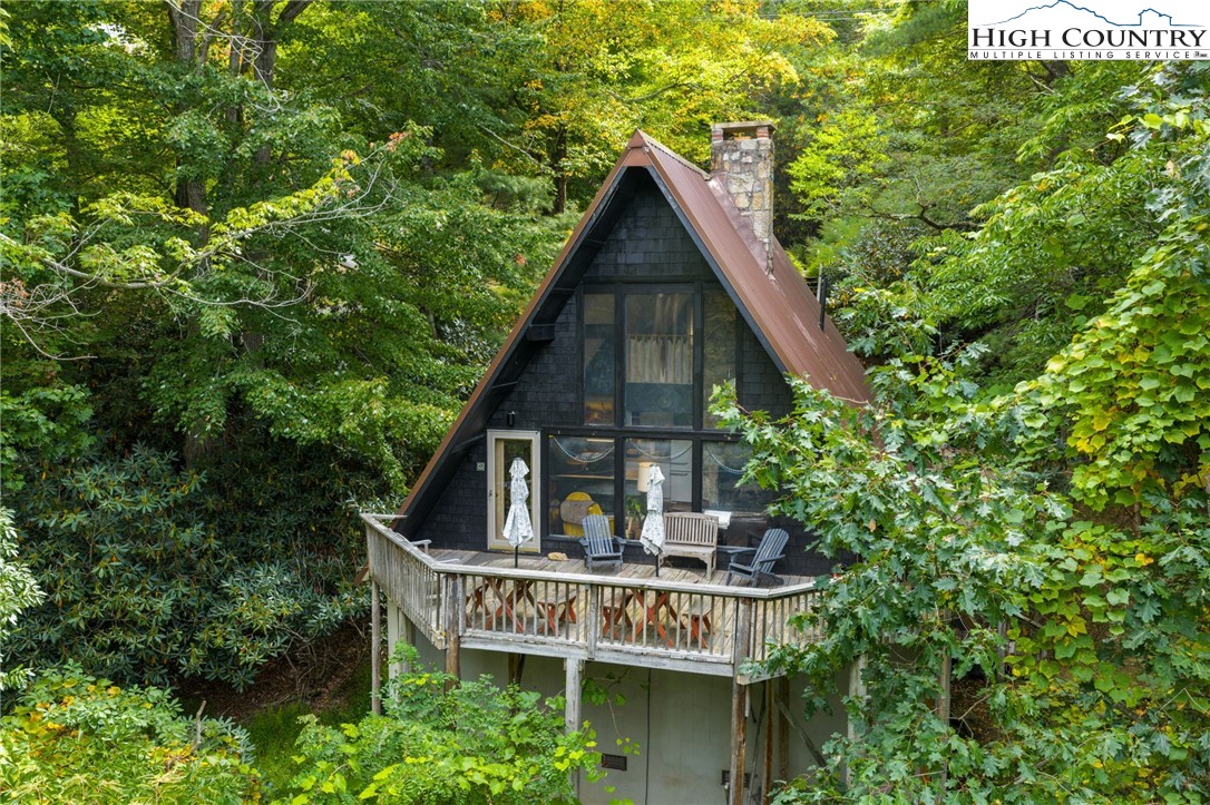 179 Rhododendron Drive Beech Mountain, NC 28604 - Photo 37 of 44 a view of a house with balcony and trees