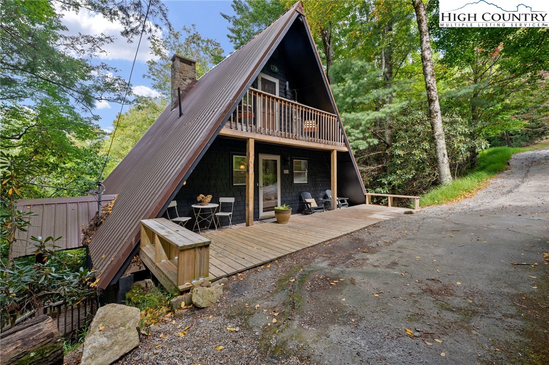 179 Rhododendron Drive Beech Mountain, NC 28604 - Photo 41 of 44 a view of an house with backyard and trees