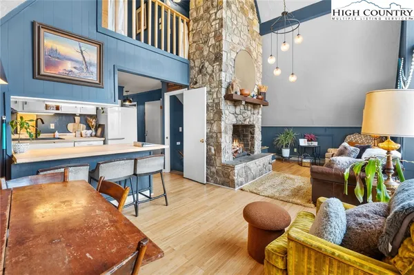 a living room with furniture and a table