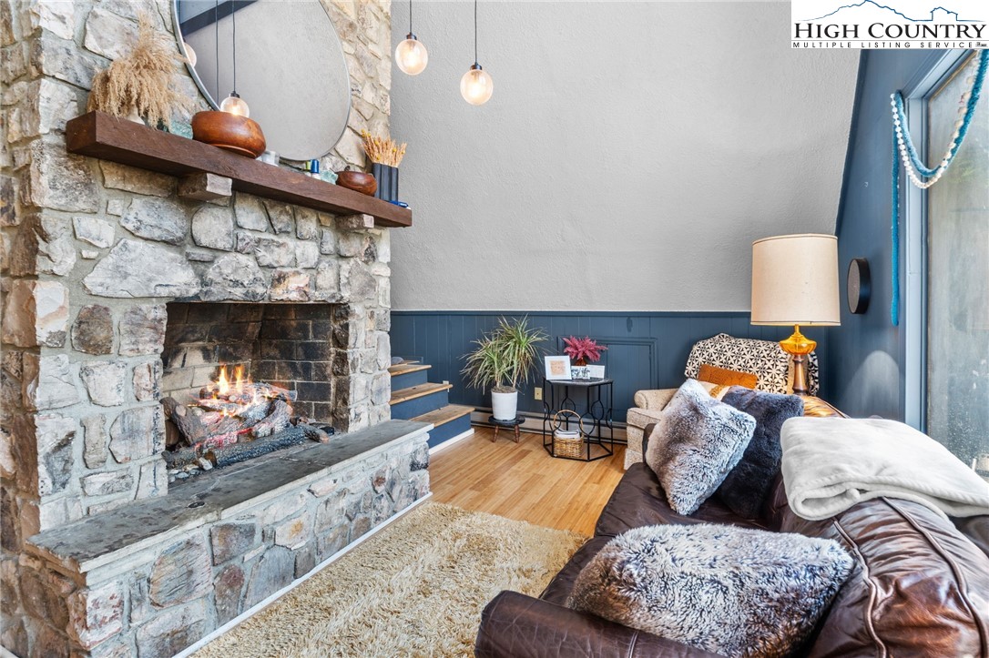 179 Rhododendron Drive Beech Mountain, NC 28604 - Photo 6 of 44 a living room with furniture and a fireplace
