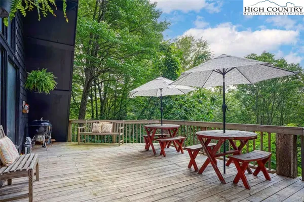 an outdoor space with furniture and umbrella
