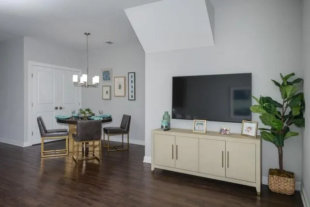 a view of a livingroom with furniture and a potted plant