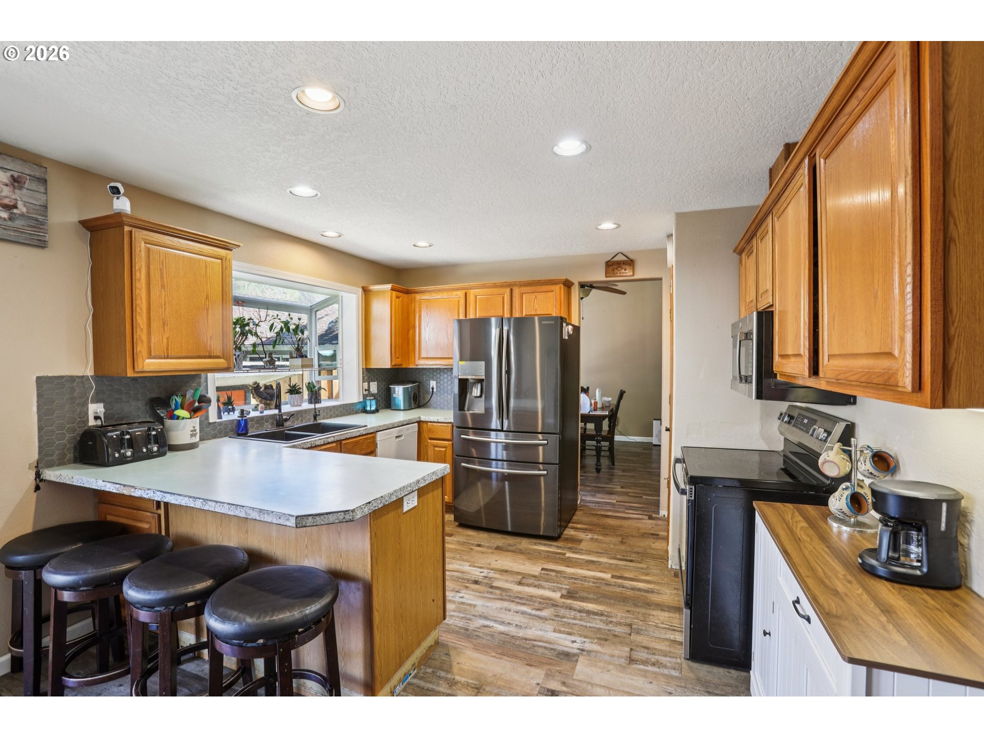 4055 Northeast 13th Terrace Gresham, OR 97030 - Photo 12 of 37 a kitchen with sink and refrigerator
