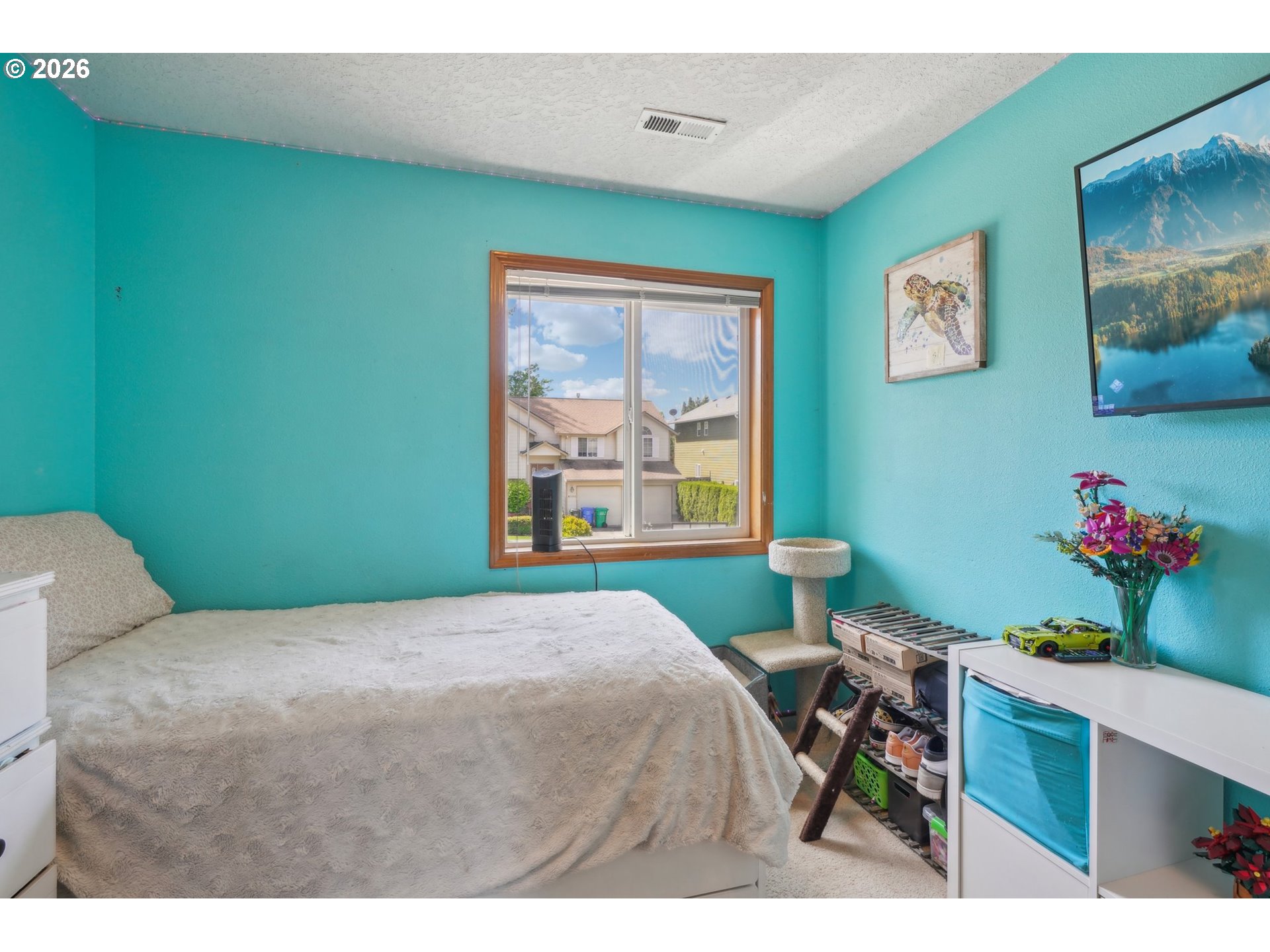 4055 Northeast 13th Terrace Gresham, OR 97030 - Photo 21 of 37 a bedroom with a bed dresser and a window