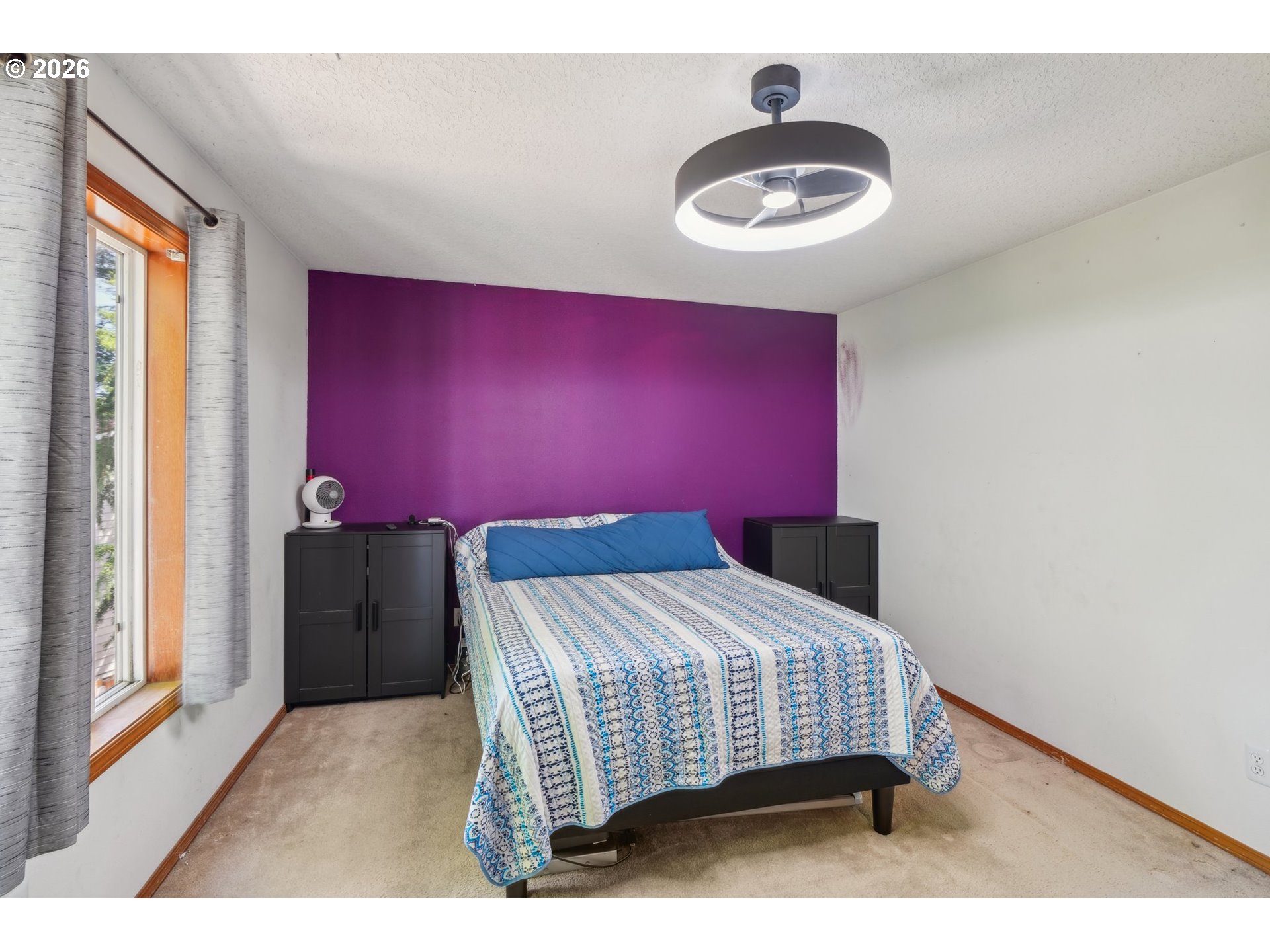 4055 Northeast 13th Terrace Gresham, OR 97030 - Photo 24 of 37 a bedroom with a bed and a chandelier