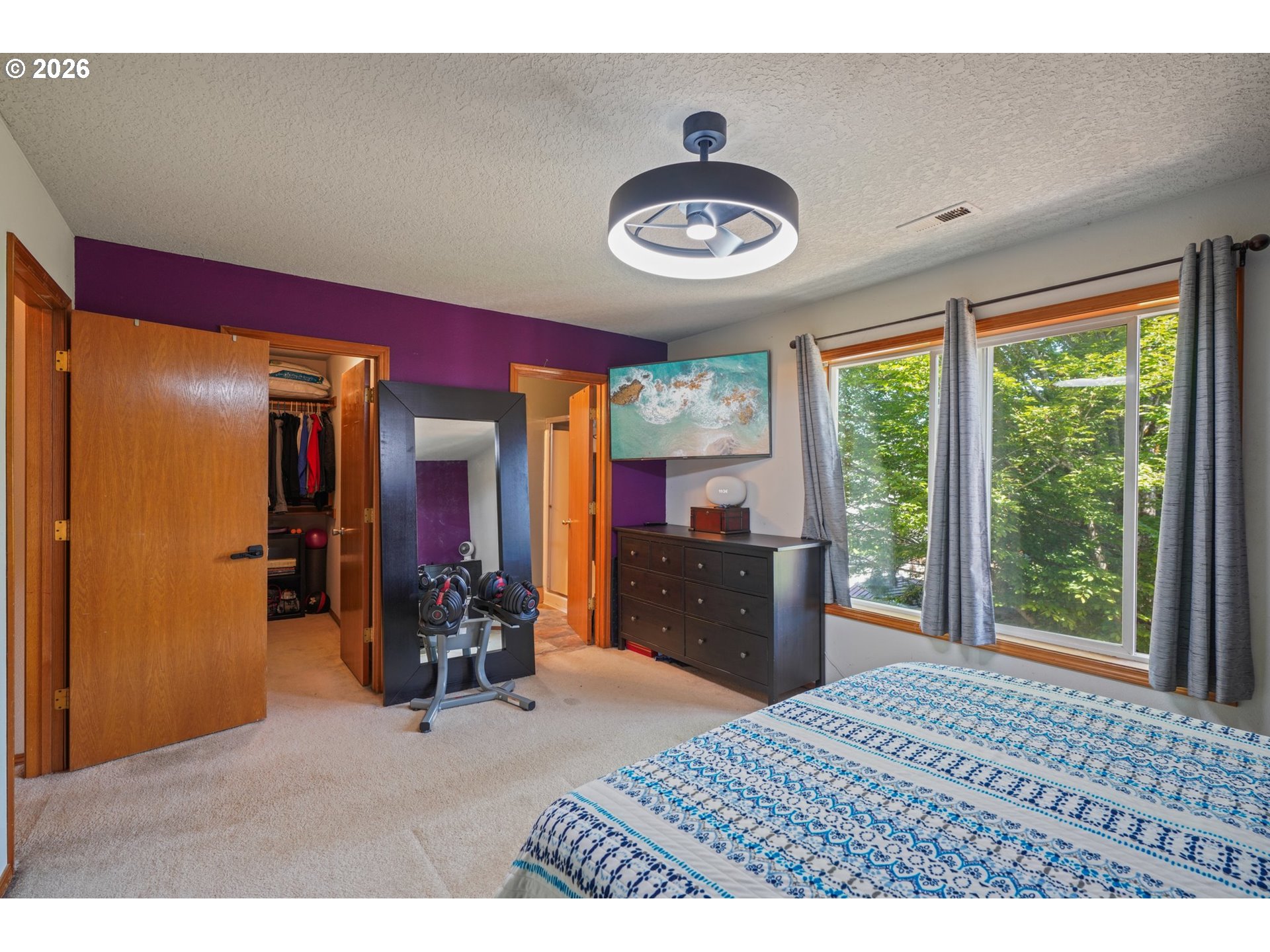 4055 Northeast 13th Terrace Gresham, OR 97030 - Photo 26 of 37 a bedroom with a bed and a large window