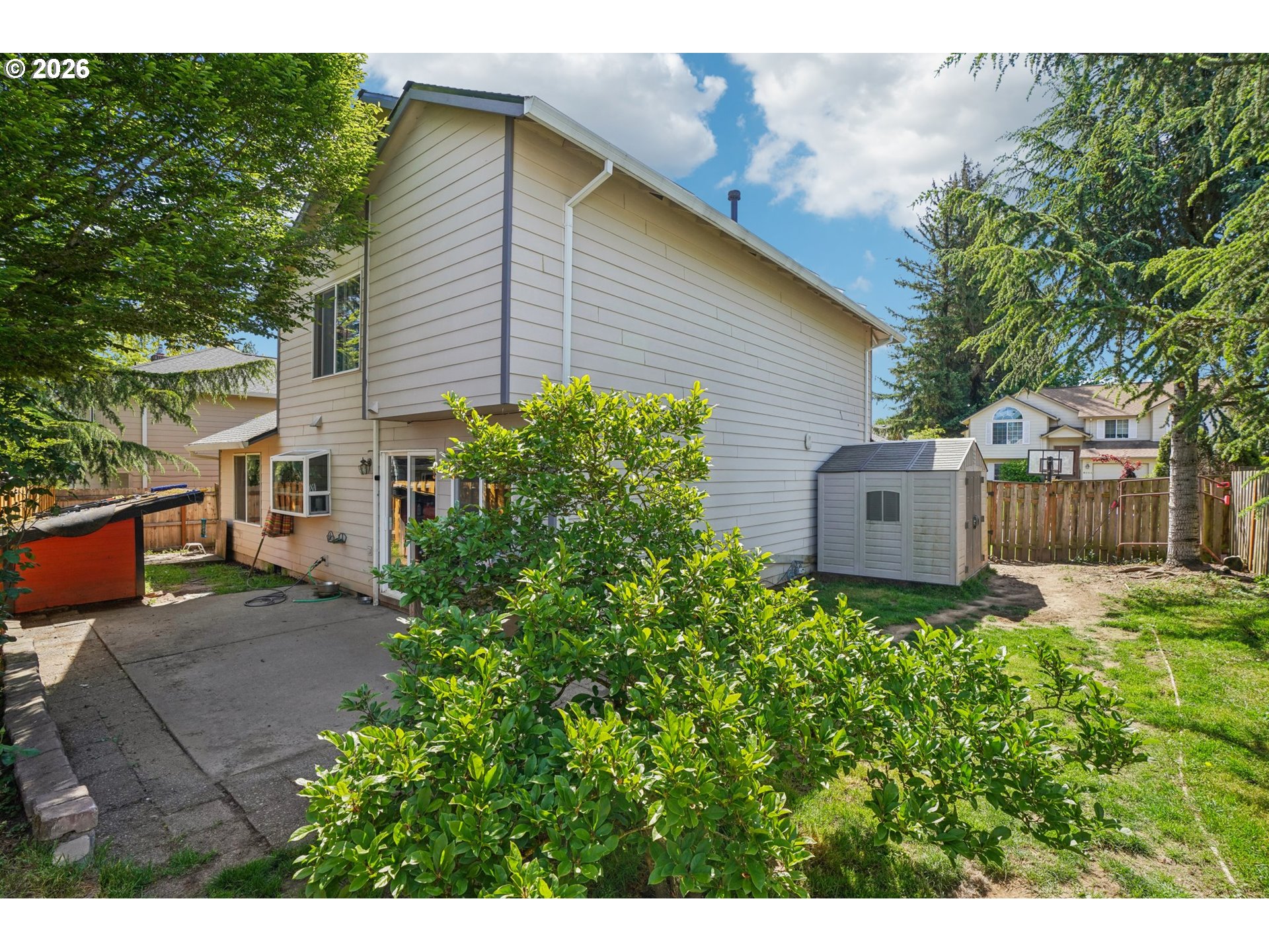 4055 Northeast 13th Terrace Gresham, OR 97030 - Photo 33 of 37 a view of a house with a yard and a garden
