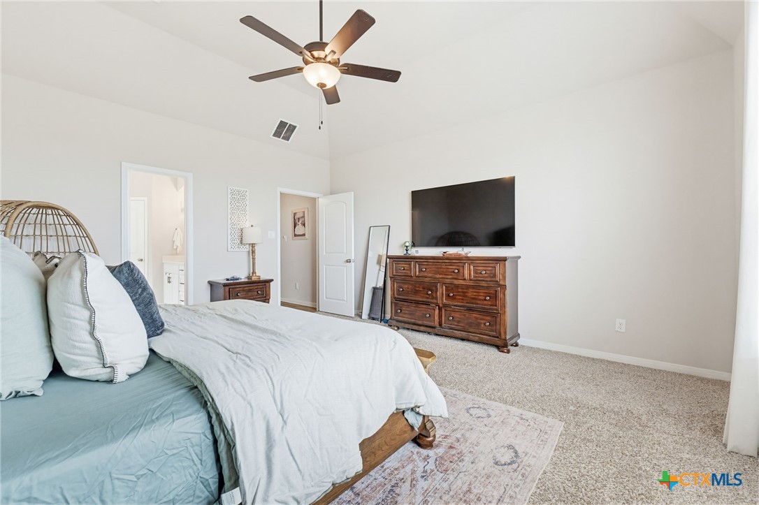 1761 Spence Street Temple, TX 76502 - Photo 15 of 30 a bedroom with a bed and a flat screen tv