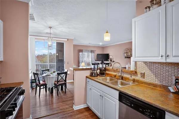 a kitchen with lots of counter top space and dining table