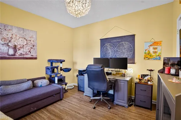 a reading room with furniture and wooden floor