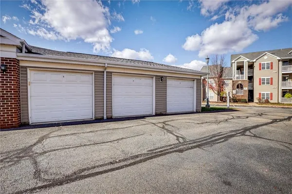 a front view of a house with a garage