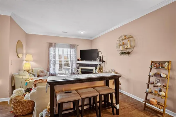 a room with furniture and a flat screen tv