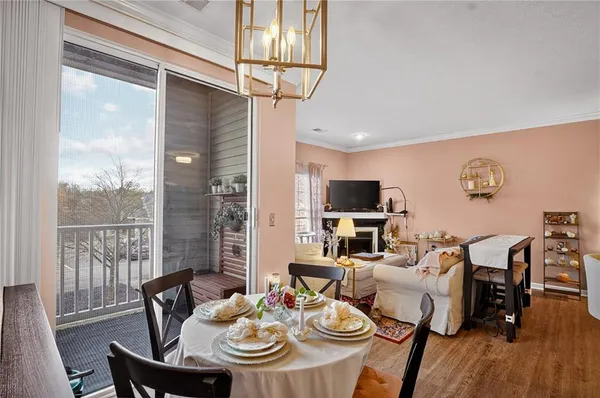 a view of a dining room with furniture window and outside view