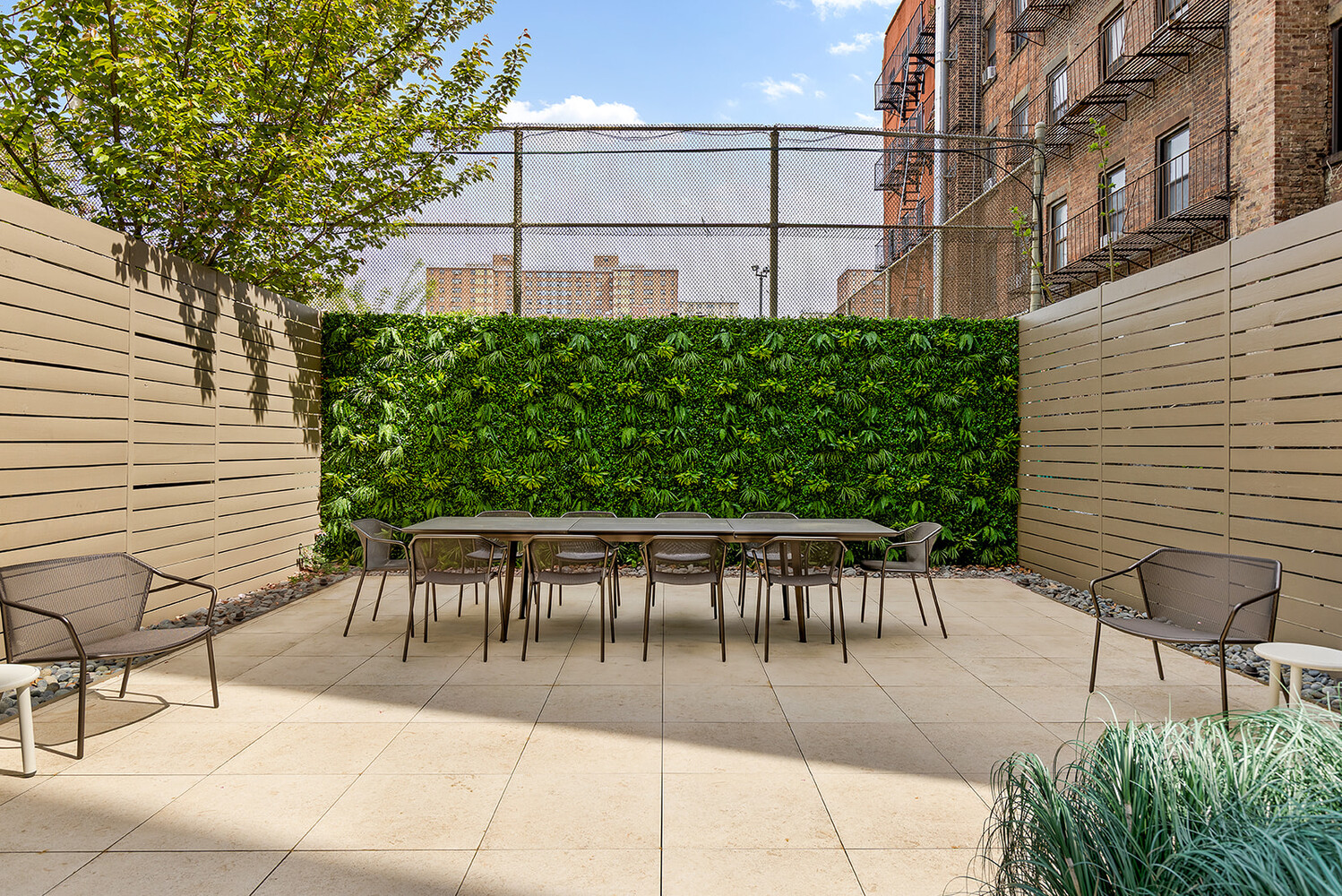 66 Clinton Street, Unit 5A Manhattan, NY 10002 - Photo 12 of 15 a view of a patio with a table and chairs