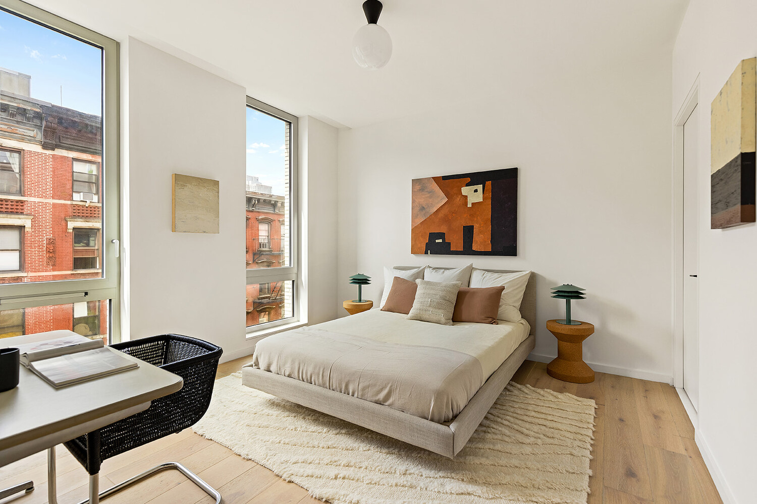 66 Clinton Street, Unit 5A Manhattan, NY 10002 - Photo 4 of 15 a bedroom with a bed and a desk