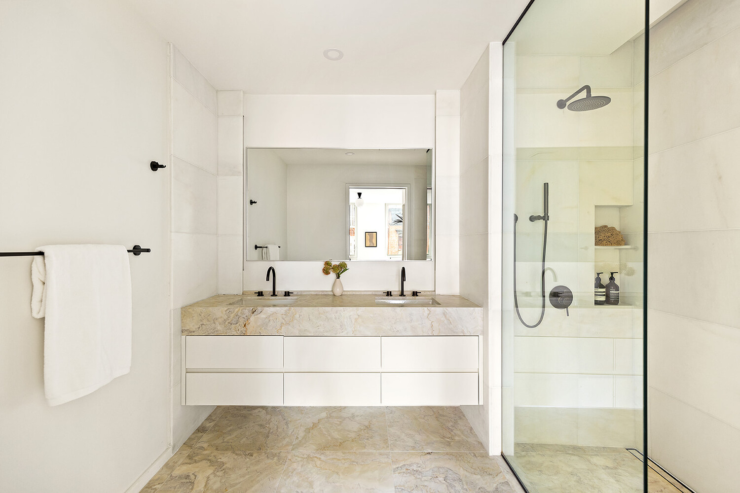 66 Clinton Street, Unit 5A Manhattan, NY 10002 - Photo 5 of 15 a bathroom with a bathtub shower and sink