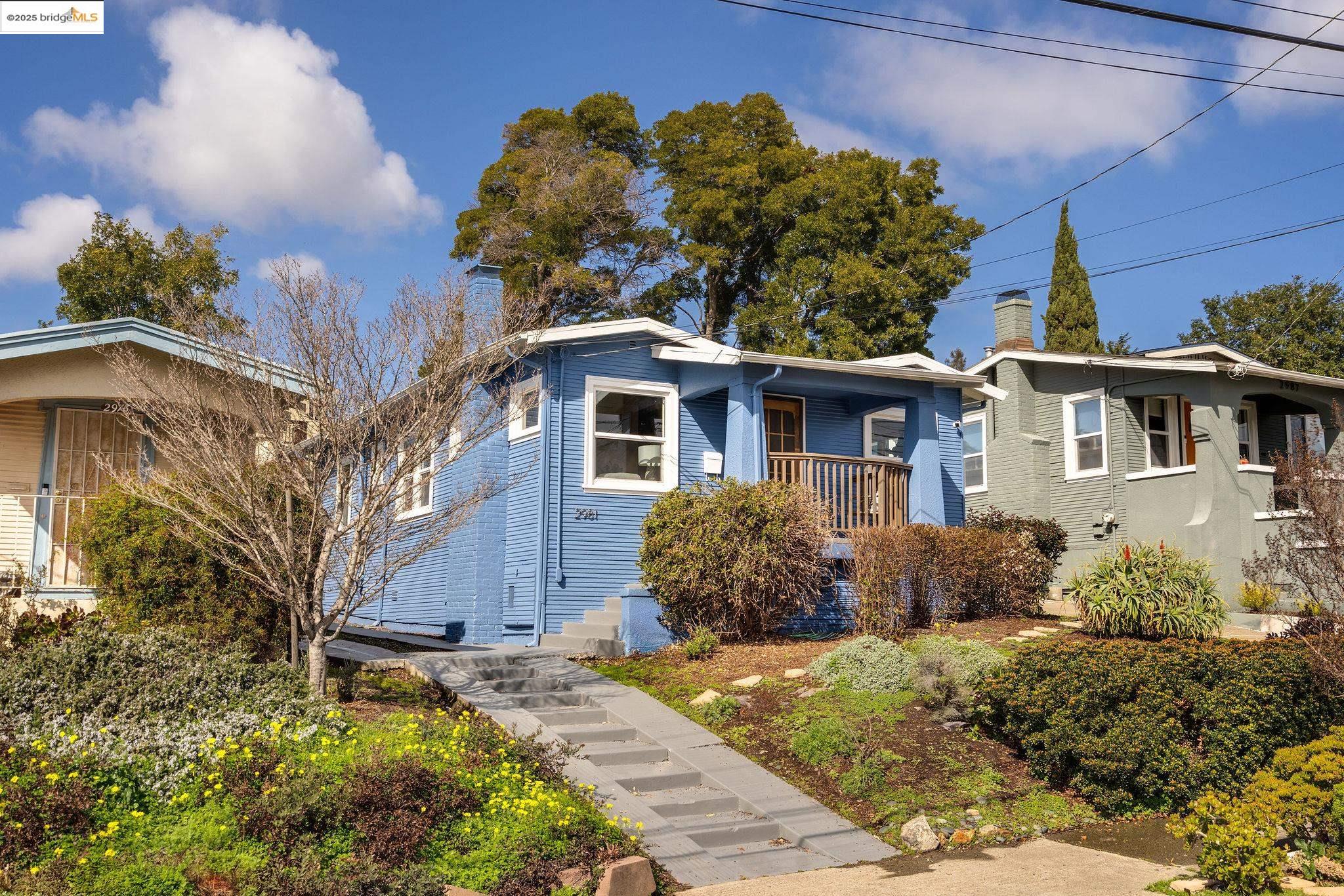 a front view of a house with garden