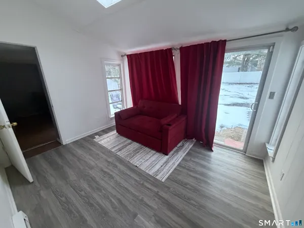 a view of a hardwood floor and wardrobe