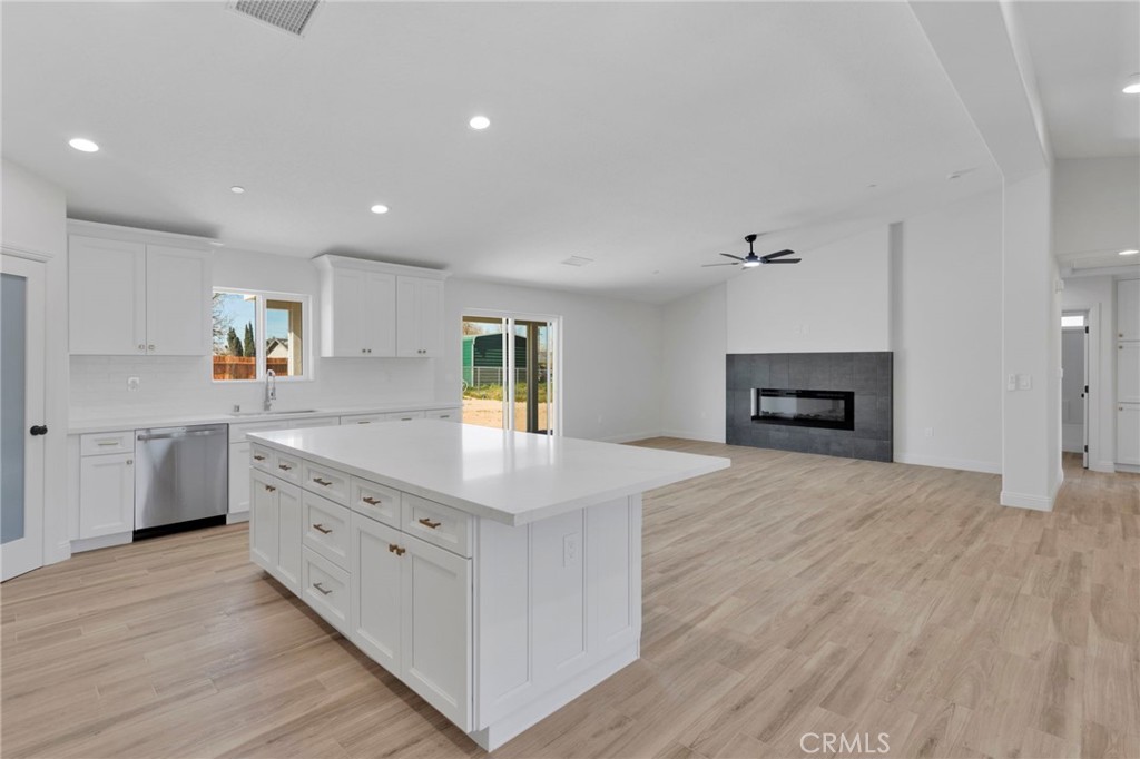 9432 Wasco Hesperia, CA 92345 - Photo 11 of 45 a kitchen with sink cabinets and wooden floor