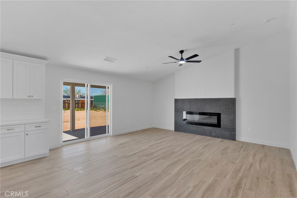 9432 Wasco Hesperia, CA 92345 - Photo 12 of 45 wooden floor in an empty room with a window